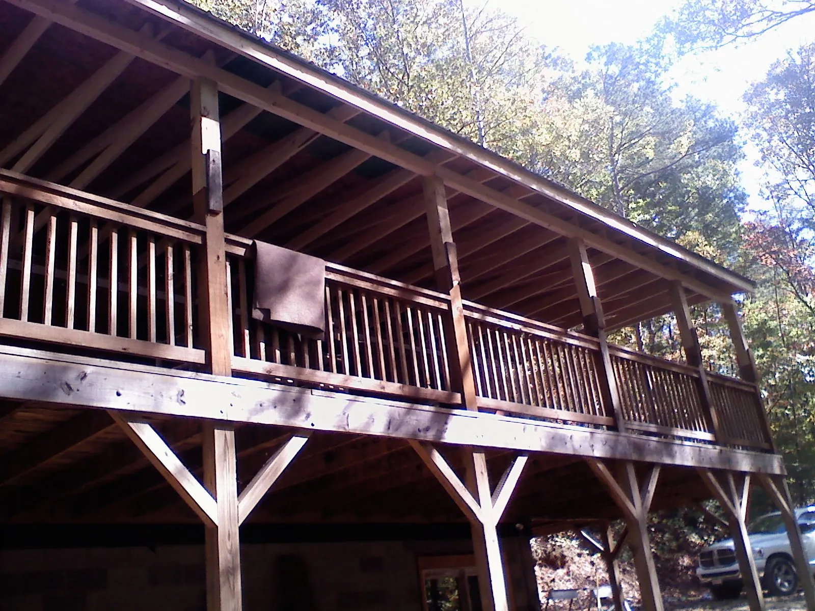Timber framing under a new elevated porch and deck — Roof Leak Repair in Armada by Roofing Brothers